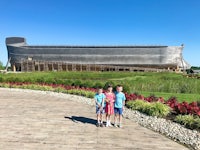 three children standing in front of the ark at noah's ark